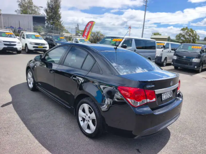 2012 HOLDEN CRUZE SRi, Black, low kilometers, sporty, $ 5999 Great looking car.