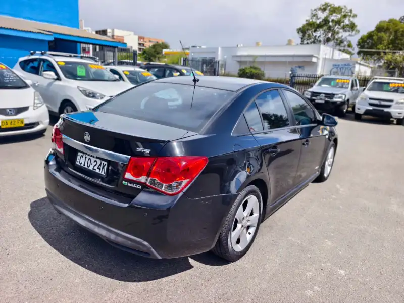 2012 HOLDEN CRUZE SRi, Black, low kilometers, sporty, $ 5999 Great looking car.
