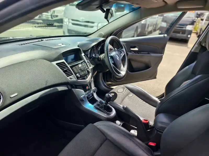 2012 HOLDEN CRUZE SRi, Black, low kilometers, sporty, $ 5999 Great looking car.