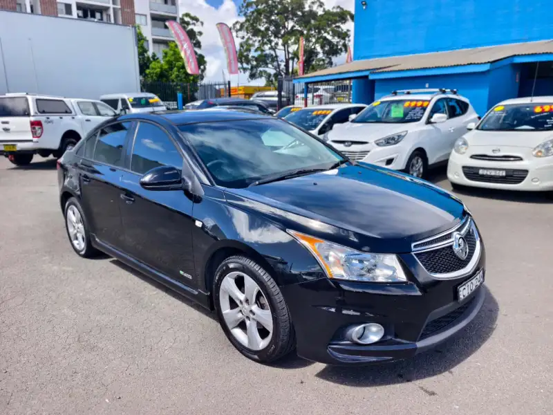 2012 HOLDEN CRUZE SRi, Black, low kilometers, sporty, $ 5999 Great looking car.