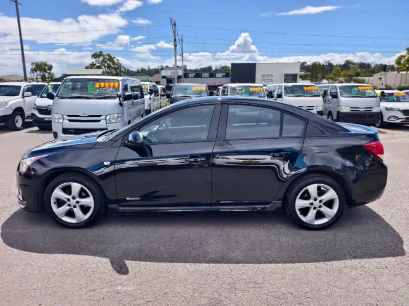 2012 HOLDEN CRUZE SRi, Black, low kilometers, sporty, $ 5999 Great looking car.