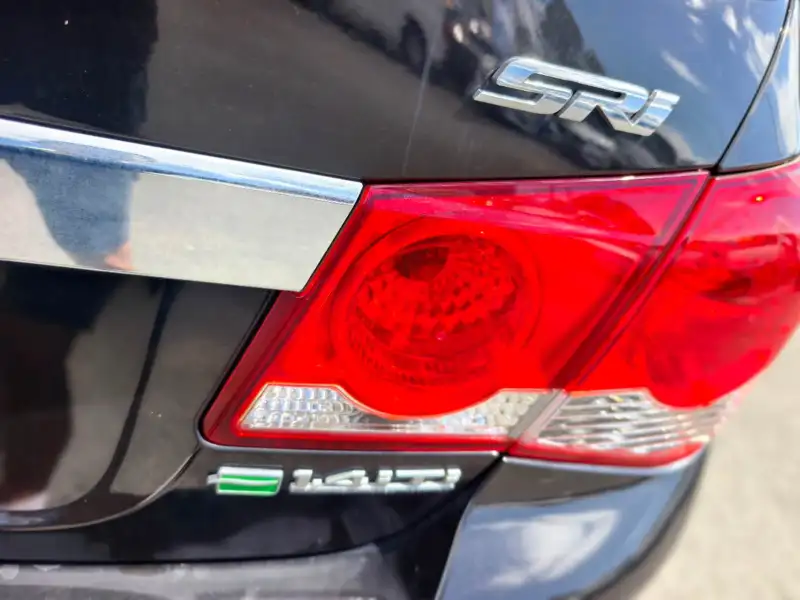 2012 HOLDEN CRUZE SRi, Black, low kilometers, sporty, $ 5999 Great looking car.