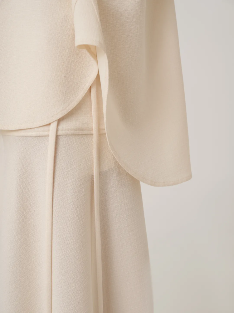 WRAP SILK MIDI SKIRT IN CREAM