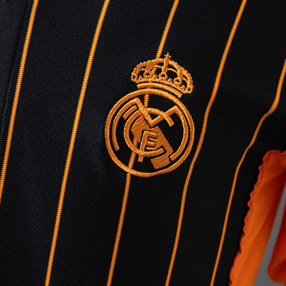 2025-26 REAL MADRID BLACK AND ORANGE US PACK FAN VERSION
