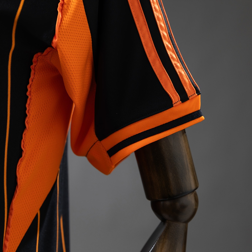 2025-26 REAL MADRID BLACK AND ORANGE US PACK FAN VERSION
