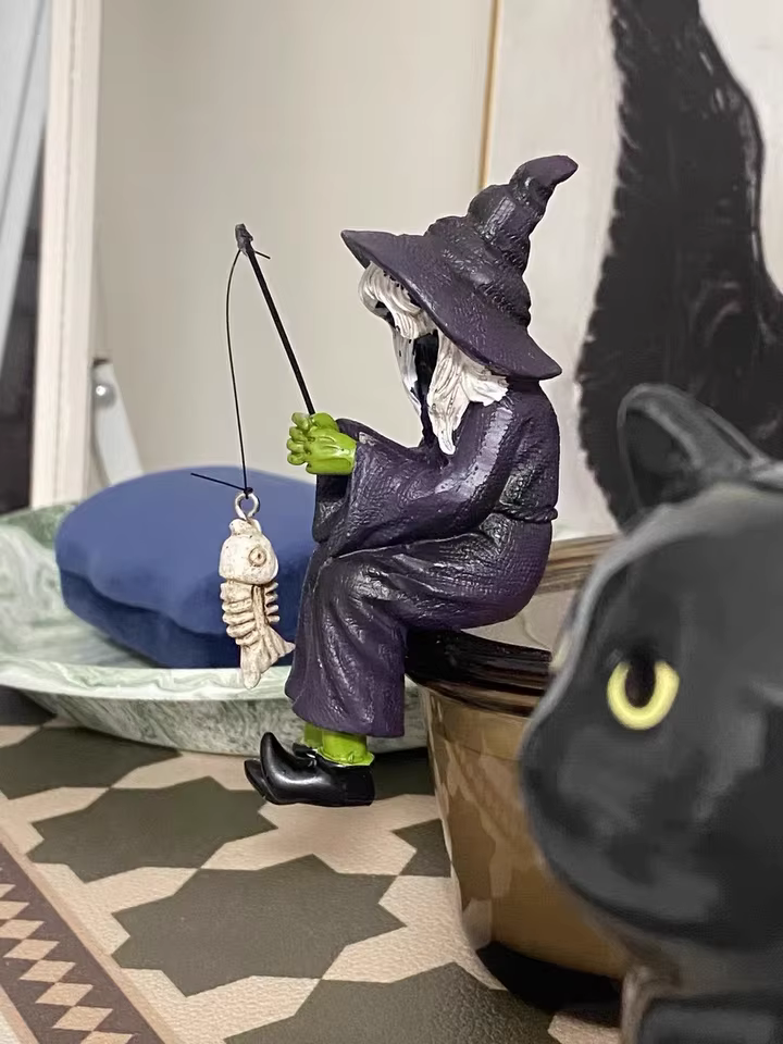Bored Witch Fishing Figurine – Gothic Witchy Shelf Sitter with Skeleton Fish