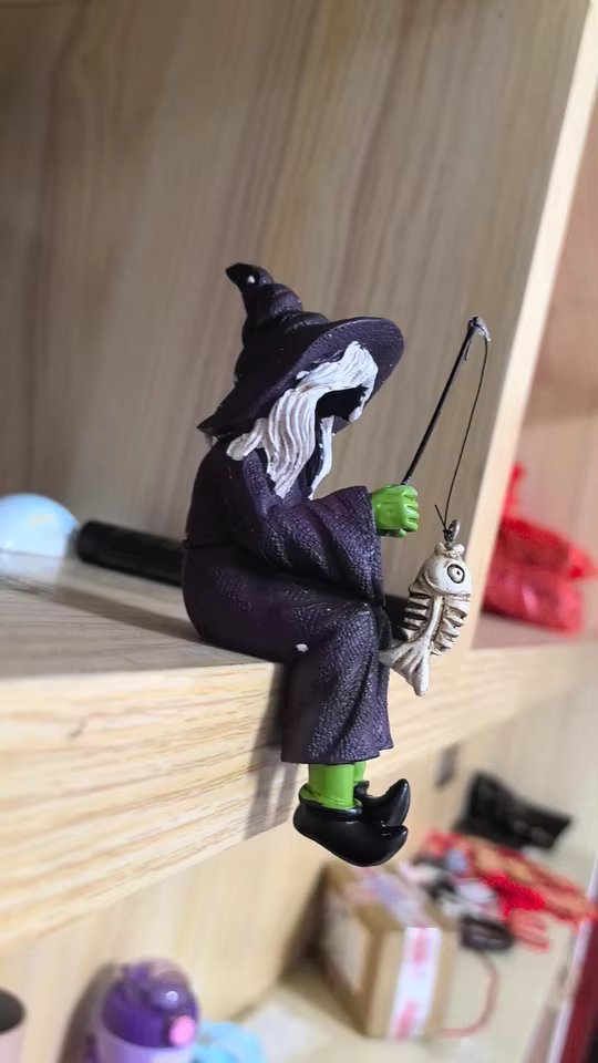 Bored Witch Fishing Figurine – Gothic Witchy Shelf Sitter with Skeleton Fish