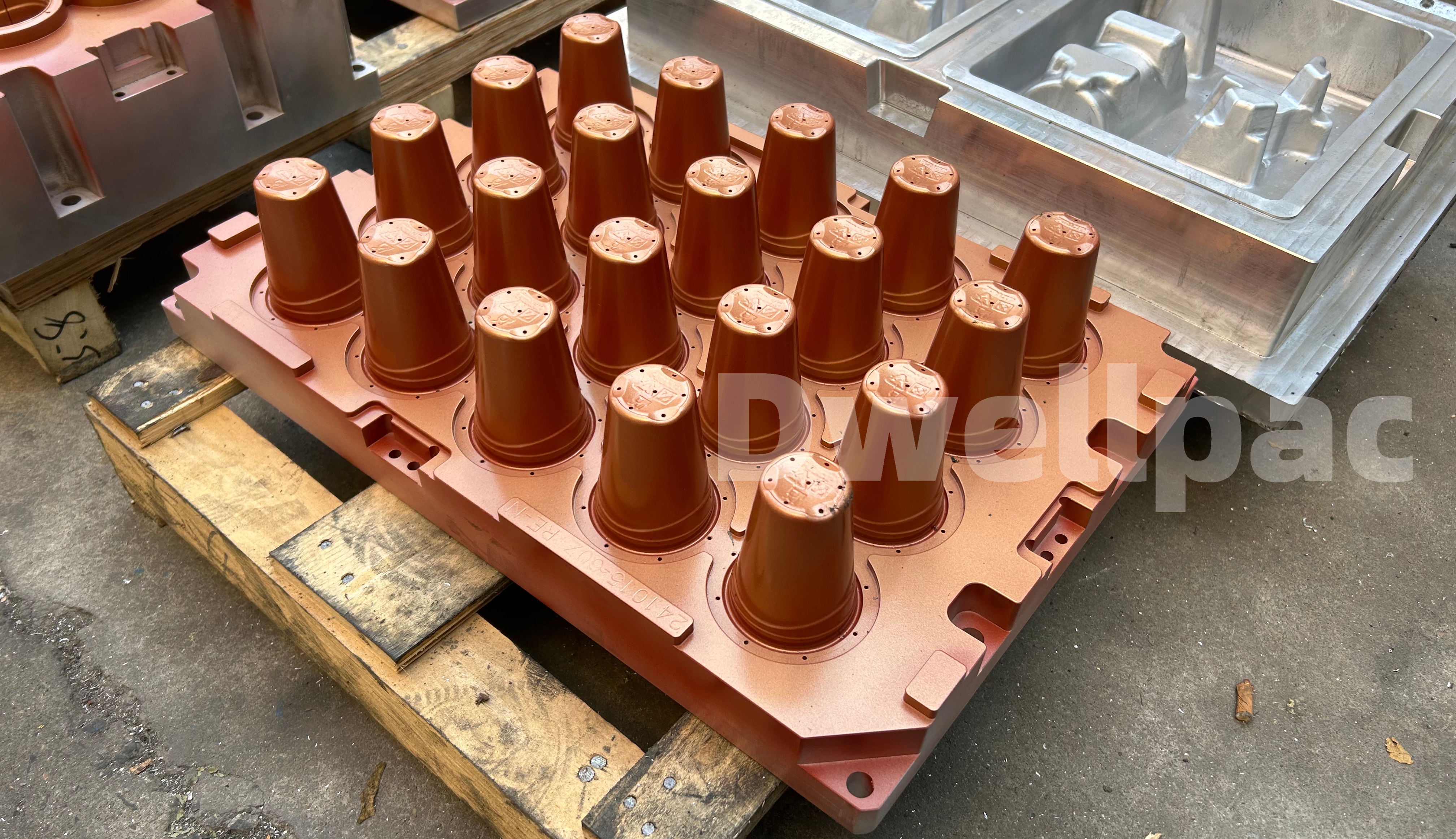 Multi-cavity cup mold assembly with tapered forming tools on a mounting plate