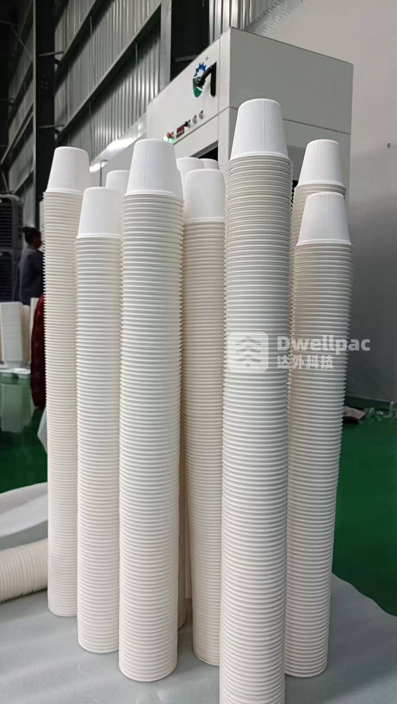 Tall stacks of nested molded pulp cups showing their stacking profile