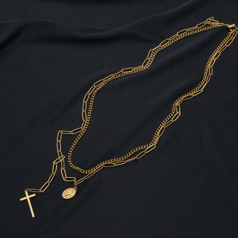 Curb chain and clip chain layered necklace with cross and virgin mary medallion