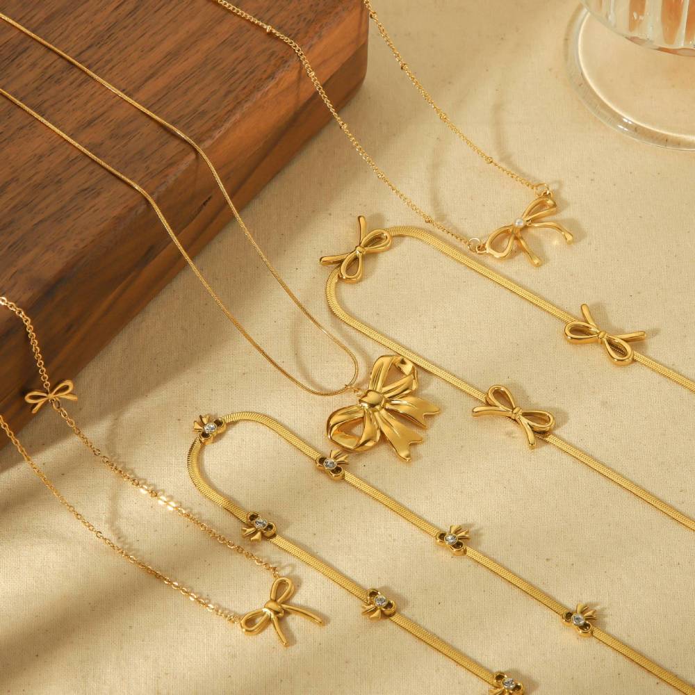 Fashion Bowknot Pendant Station Necklace in PVD Gold Plated Stainless Steel