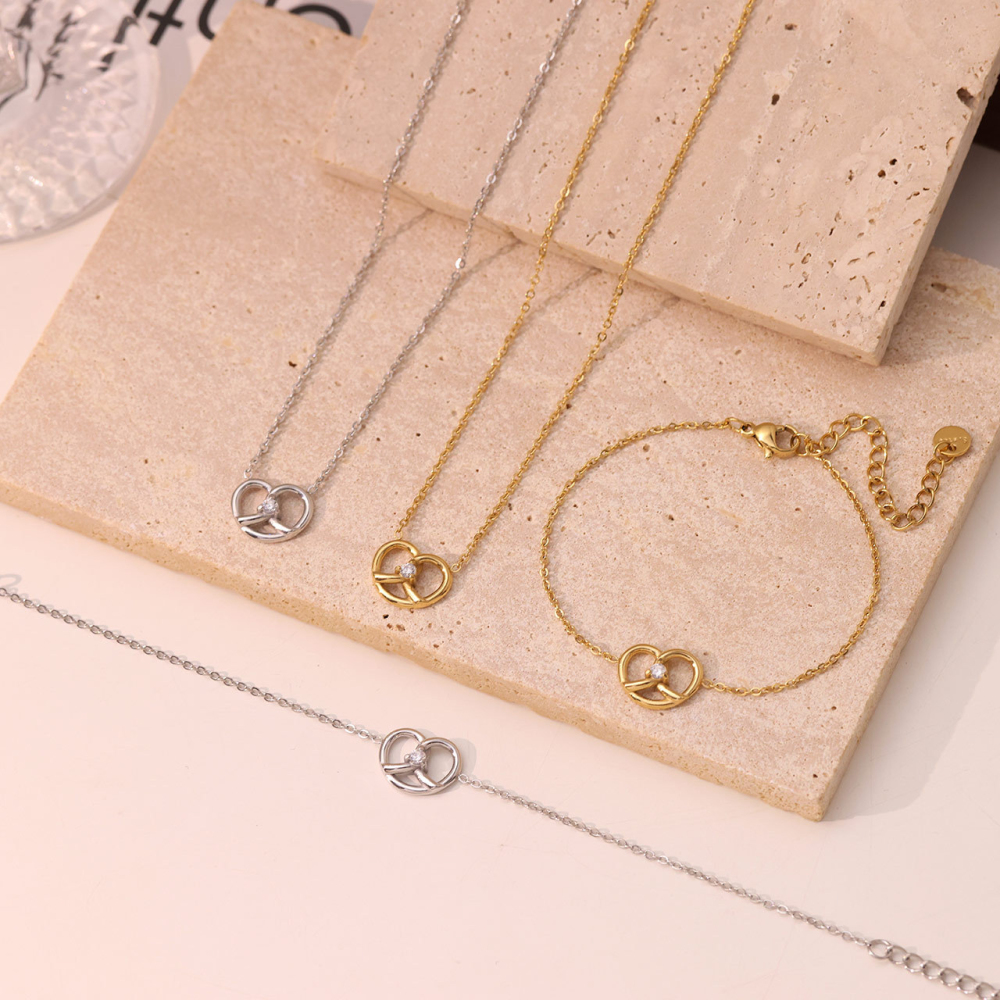 Interlocking Heart Necklace and Bracelet Set in PVD Stainless Steel 14K Gold