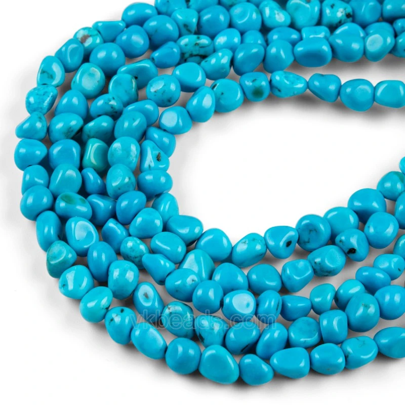 Close view of blue magnesite turquoise through-drilled nugget beads