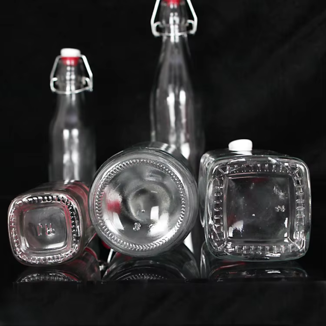 Wholesale Airtight Clip Top Drinking Bulk Transparent Glass Bottles for Juice Milk