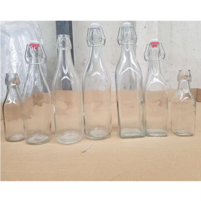 Hot sale custom clear beer bottle with opener and swing top