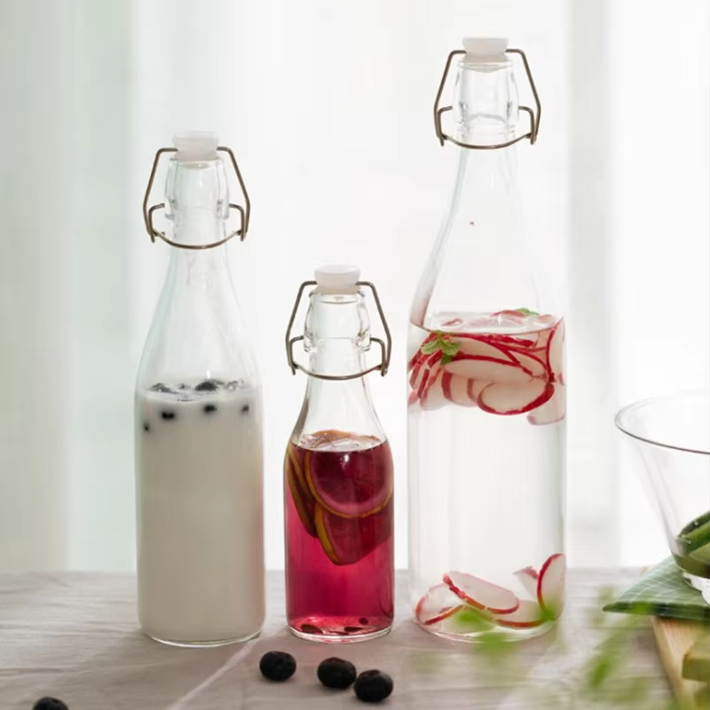 Wholesale 500ml 750ml flip swing top glass water bottle for juice