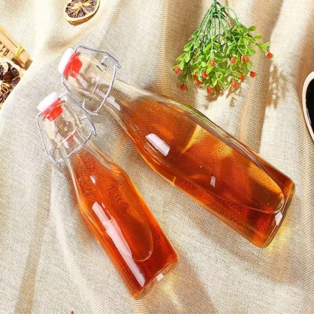 Wholesale 500ml 750ml flip swing top glass water bottle for juice