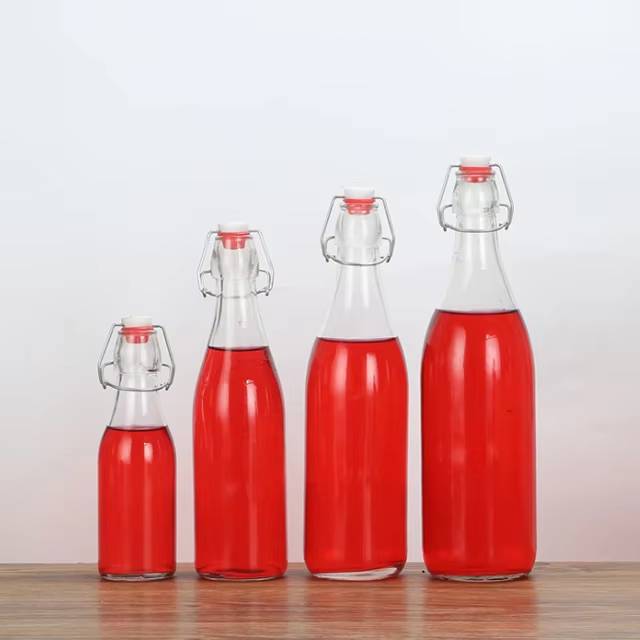 Custom 330ml 500ml 750ml glass drink water bottles with swing top
