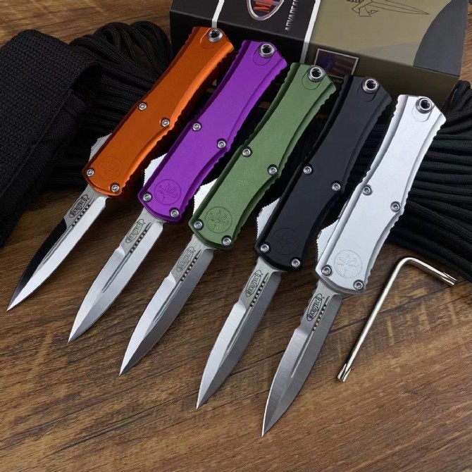 Microtech Hera OTF AUTO Knife 2.79" D2 Double Edge Serrated Blade, Aviation Aluminum Handles