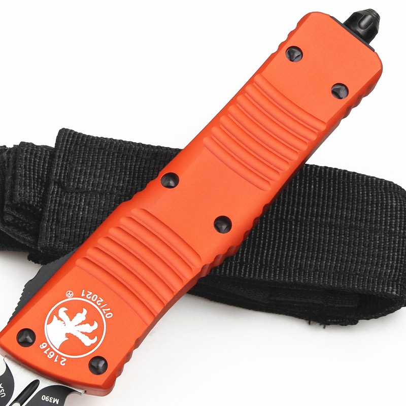 Microtech Troodon AUTO OTF Knife 3.74" M390 Double Combo Edge Dagger Blade, Orange Aluminum Handles