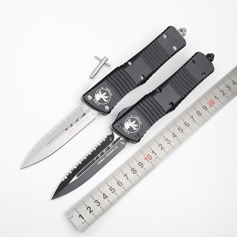 Microtech Troodon AUTO OTF Knife 3.74" M390 Double Combo Edge Dagger Blade, Black Aluminum Handles