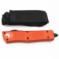 Microtech Troodon AUTO OTF Knife 3.74" M390 Double Combo Edge Dagger Blade, Orange Aluminum Handles