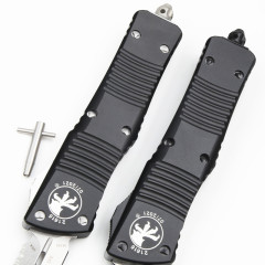 Microtech Troodon AUTO OTF Knife 3.74" M390 Double Combo Edge Dagger Blade, Black Aluminum Handles