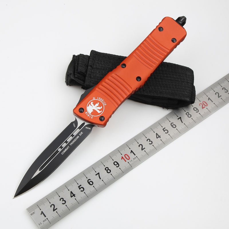 Microtech Troodon AUTO OTF Knife 3.74" M390 Double Combo Edge Dagger Blade, Orange Aluminum Handles