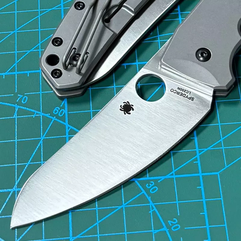 Spyderco Marcin Slysz Folding Knife 3.15" LC200 N Satin Plain Blade, Gray Titanium Handles, Frame Lock - C211TIP
