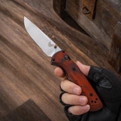 BM 15090 Hunt Bugout Axis Folding 3.46" Magnacut Clip Point Blade, G10/Dymondwood Handles