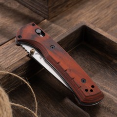 BM 15090 Hunt Bugout Axis Folding 3.46" Magnacut Clip Point Blade, G10/Dymondwood Handles