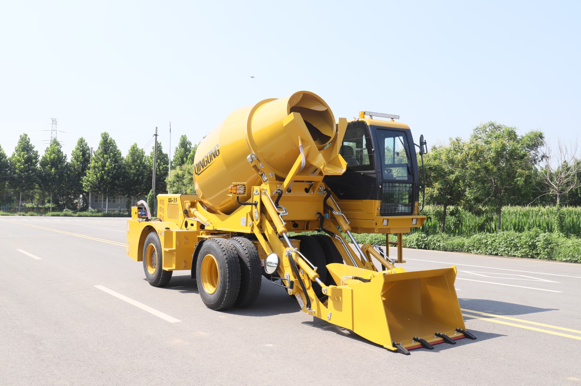 Self-loading concrete mixer