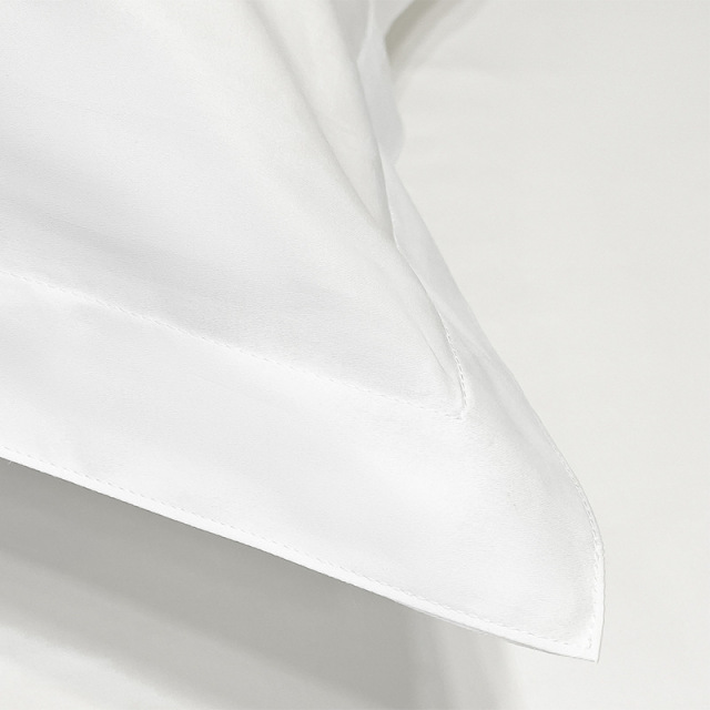 Commercial-grade pillowcase hemming - Double-stitched 2cm border for 200+ industrial washes