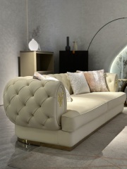 Luxury Cream Tufted Sofa with Decorative Accents