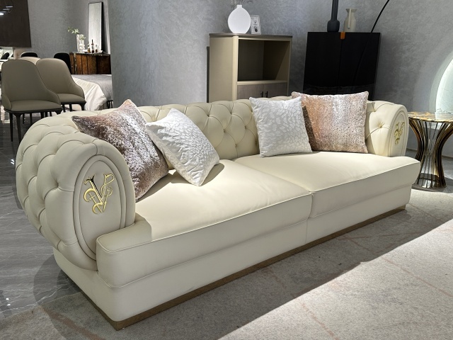 Luxury Cream Tufted Sofa with Decorative Accents