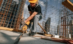 a worker use Raicho cutting discs to cut off the steel bar at one building site