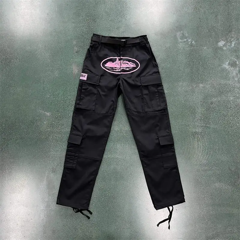 Black and pink Corteiz cargo trousers used as the fixed pair in the day-to-night outfit guide