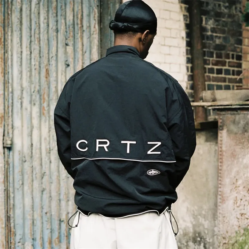 Black Wingz Shuku jacket worn with dark trousers