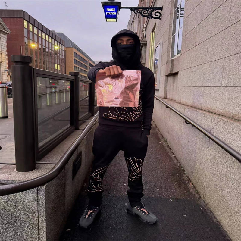 Syna World Logo Slice Tracksuit Black Gold Wearing Effect