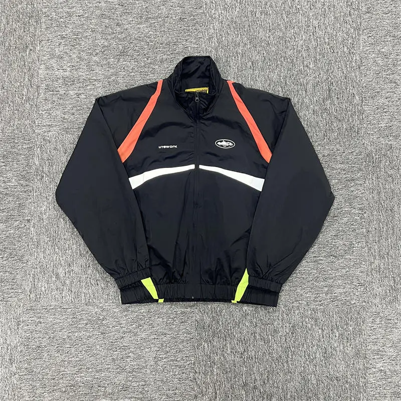 Corteiz Gradient Litework jacket showing dark main field with contrasting panels