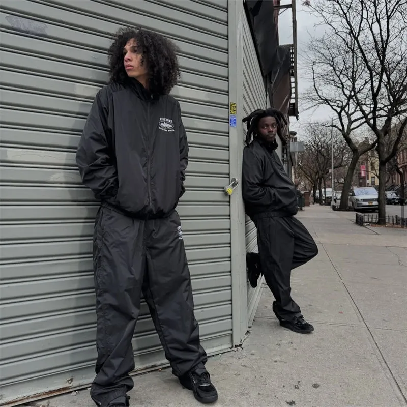Corteiz Og Shuku black and white outer layer worn in a complete outfit