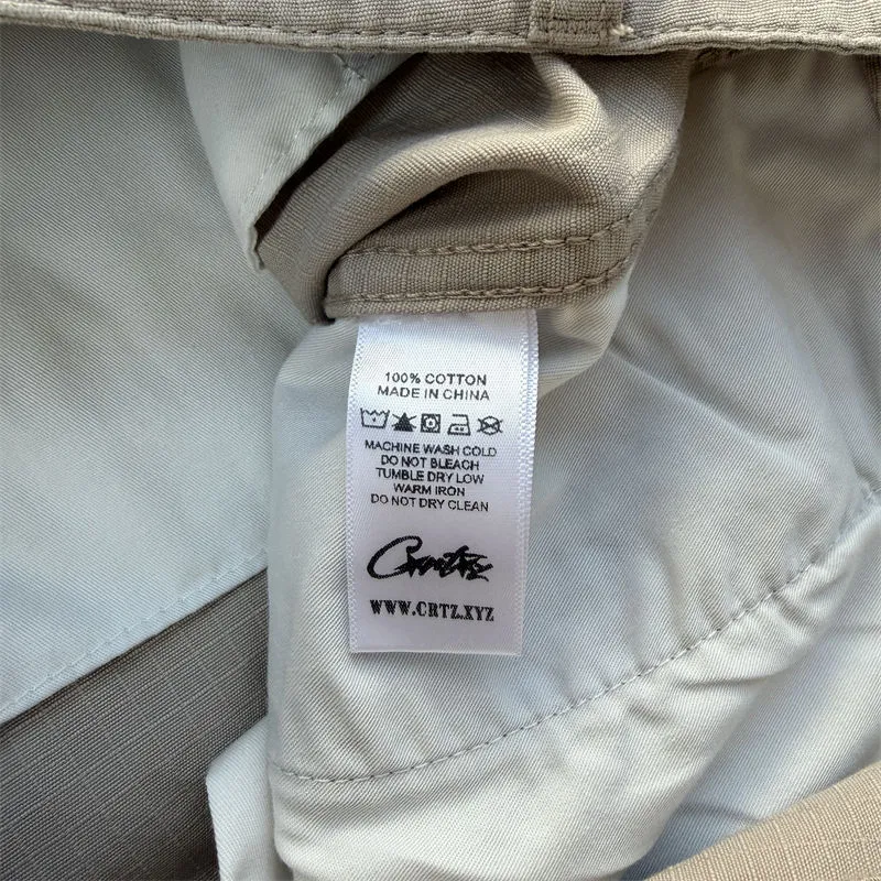 Corteiz Guerillaz cargo pants care label detail