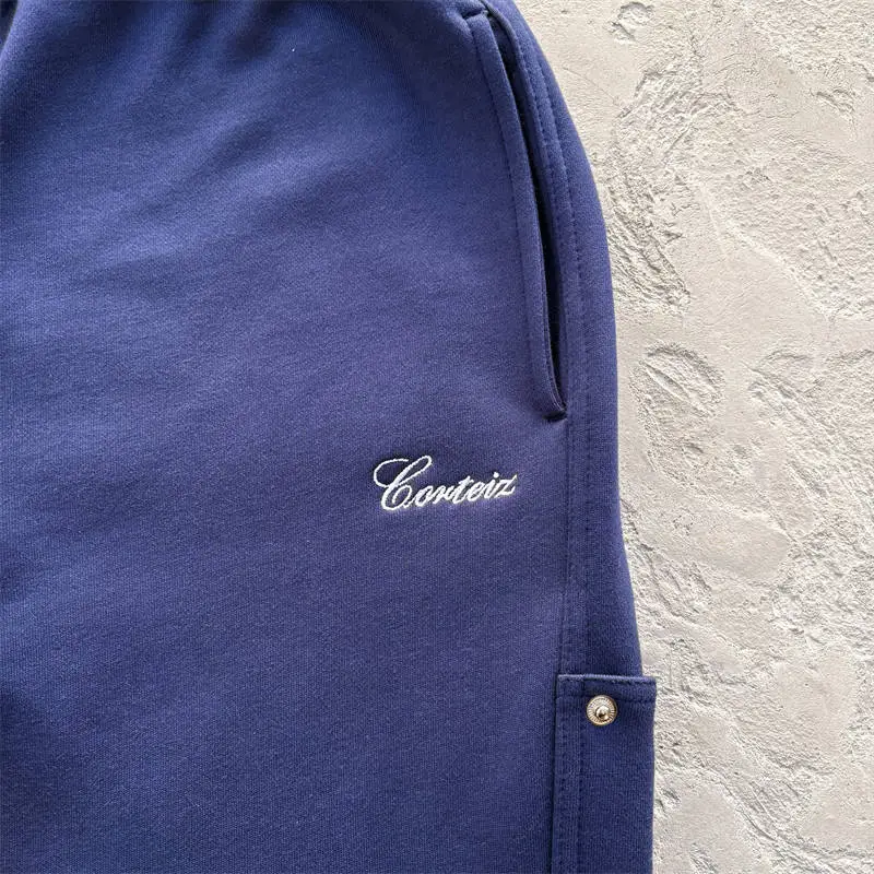 Close view of the small script branding on Corteiz Ardwear Work sweatpants