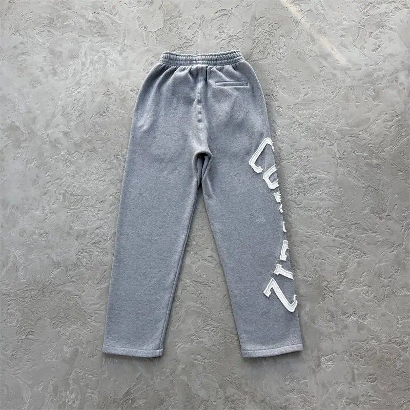 Grey Corteiz Lundun Stitch open hem sweatpants with large white leg lettering