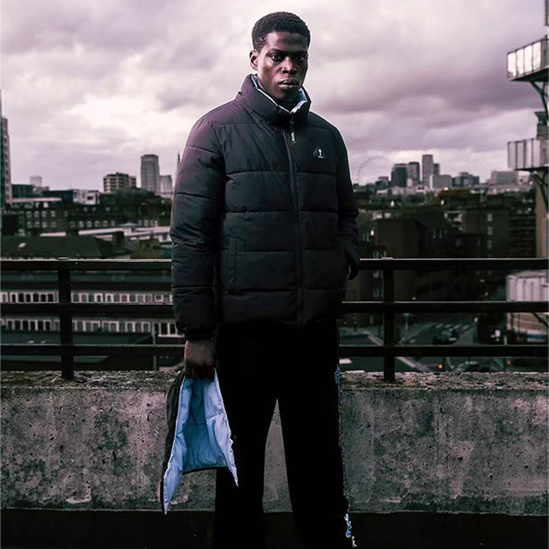 Trapstar Irongate Arch Reversible Puffer Jacket Black Blue Wearing Effect