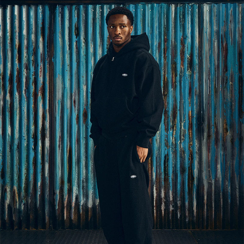Corteiz Mini Island Zip Hoodie and Sweatpant Black Wearing Effect