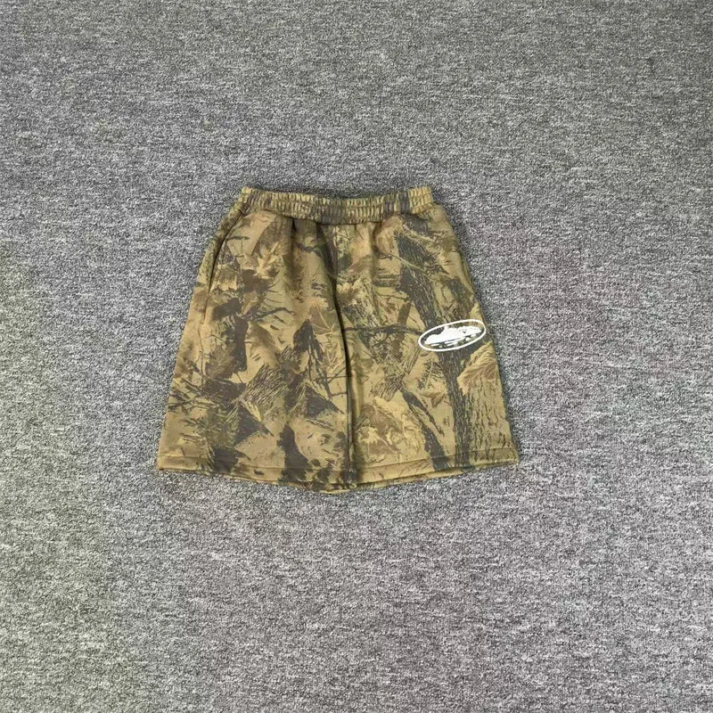 Forest camo Corteiz Island Puff Print shorts for a late-summer streetwear base