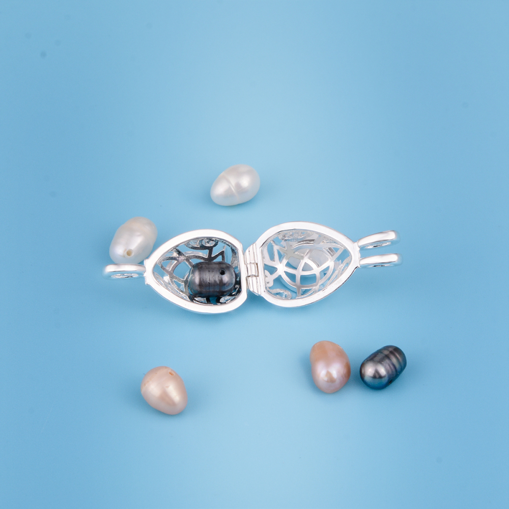 Silver-plated Celtic Knot Teardrop Pearls Cage Pendant