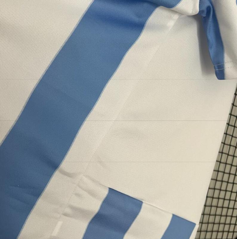 retro 12 13 malaga home jersey