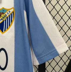 retro 12 13 malaga home jersey
